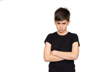 Portrait of a frowning upset little boy looking at camera isolated over white background