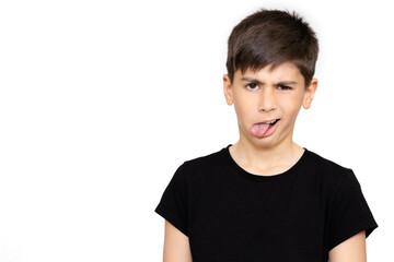 Boy sticking out his tongue on white background