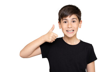 Cropped portrait of a smiling young boy showing thumb up isolated over white background