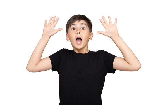 Little boy asian kid wearing casual black tshirt scared and amazed with open mouth for surprise, disbelief face