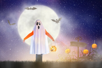 Fototapeta na wymiar Kids in ghost costume on Halloween trick or treat