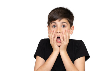 Little boy asian kid wearing casual black tshirt scared and amazed with open mouth for surprise,...