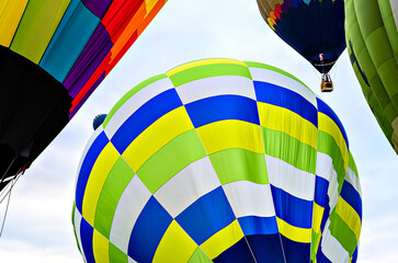 Colorful hot air balloon flying over blue sky
