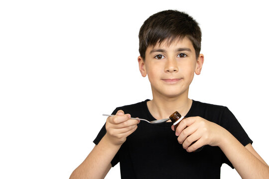 Patient boy takes medicine syrup .Isolated on the white background