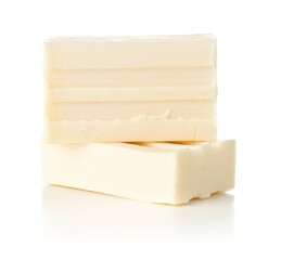 Two white pieces of soap bar over white