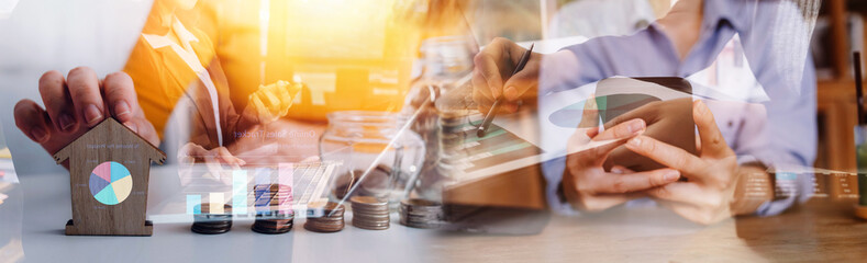 Businessman hands working with finances about cost and calculator and laptop with tablet, smartphone at office in morning light