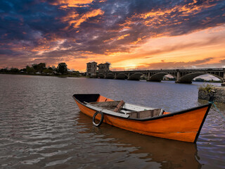 Stormy sunrise over abandoned fishing boats 