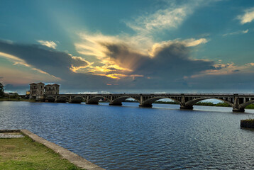 Obraz premium beautiful old bridge with sunset