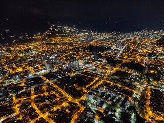 aerial view of the city of ibague at night with lots of lights and selective focus
