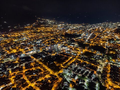 aerial view of the city of ibague at night with lots of lights and selective focus