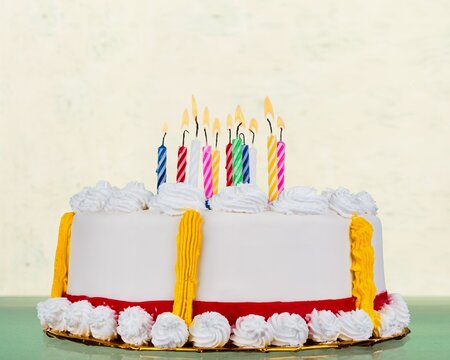 Extravagant Birthday Cake With Lots Of Birthday Candles Against A Background