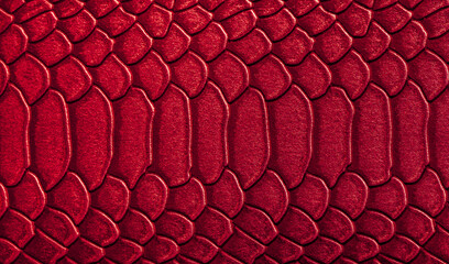Beautiful red, pink bright snake or crocodile skin, reptile skin texture, multicolored close-up as a background.