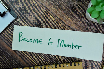 Concept of Become A member write on sticky notes isolated on Wooden Table. - obrazy, fototapety, plakaty