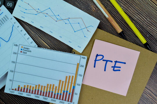 Concept of PTE write on sticky notes isolated on Wooden Table.