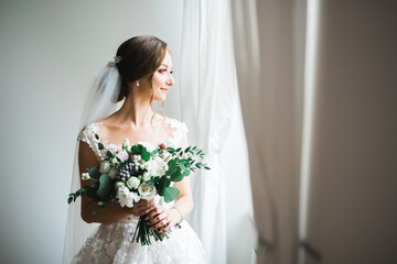 Bride holding big and beautiful wedding bouquet with flowers