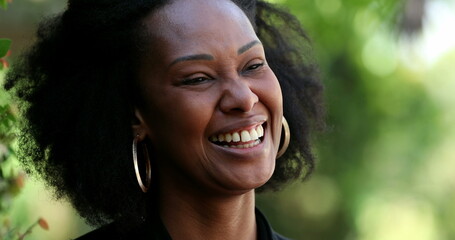 African woman laughing and smiling. Black lady authentic laugh - obrazy, fototapety, plakaty