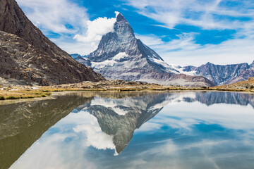 Reflection of the Matterhorn peak (also known as Cervino or Cervin). This peaks is located near the...