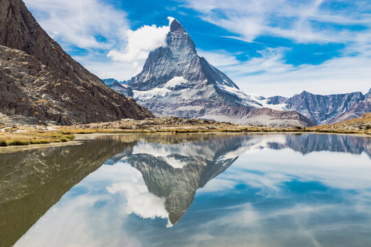 Reflection of the Matterhorn peak (also known as Cervino or Cervin). This peaks is located near the town of Zermatt, Switzerland. The swiss lake that reflects the mountain is called Riffelsee
