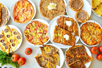 Delicious meat kebab with fresh vegetable salad served with variety of Turkish dishes and appetizers. Top view of assorted Turkish food and meze, tasty and healthy Mediterranean cuisine.