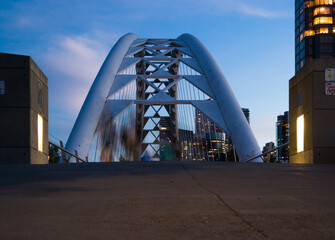 Front of bridge - evening time in city - buildings, long exposure - human fuss