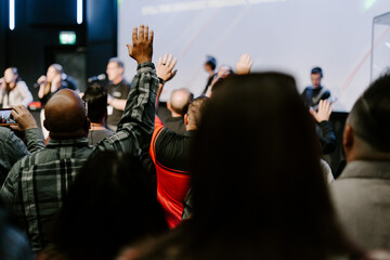Hands in the air of people who praise God at church service - 535340236