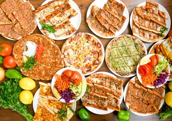 Table scene of assorted take out or delivery foods. Traditional Turkish cuisine. Various Turkish meal and appetizers. Top down view on a table.