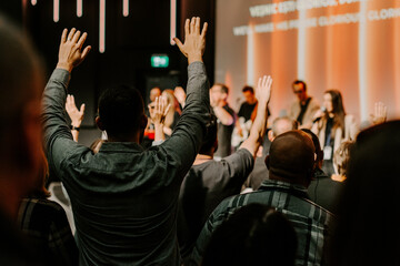 Hands in the air of people who praise God at church service - 535340255