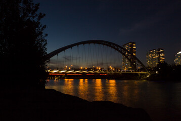 city harbor bridge - night lights and water reflection 