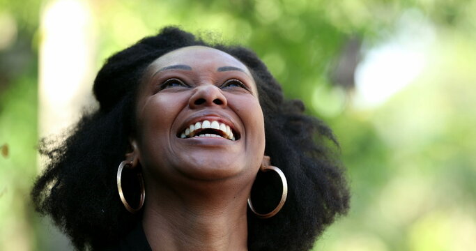 African woman laughing and smiling. Black lady authentic laugh