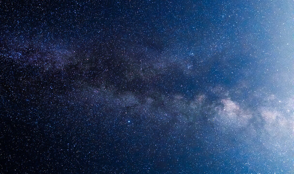 Beautiful bright milky way galaxy. Night photography, starry sky. © Inga Av
