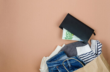 craft paper bag with full of used clothing  for recycling or donation