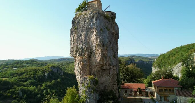The Katskhi pillar and the temple erected on it. A symbol of Orthodoxy in Georgia. Aerial view. A small monastery complex with a chapel on top of a cliff. Katskhi Column