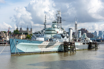 Warship on the Thames against the backdrop of city buildings, urban landscape