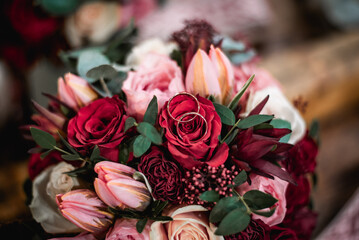 Two wedding rings on flower bouquet