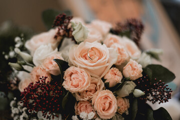 Two wedding rings on flower bouquet