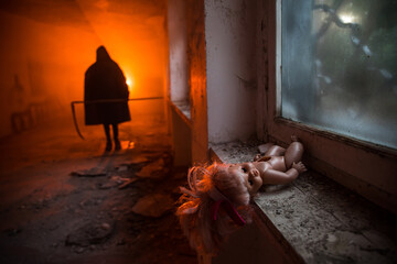 Old toy on a windowsill in an abandoned house in Chernobyl Ukraine. Post apocalyptic concept.
