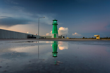 Green lighthouse on the western breakwater in Nowy Port, Gdansk.