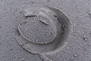 The footprint of a hoof in the sand