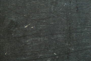 Background of a black awning in close-up. The texture of an old worn tarpaulin. The tent tarpaulin...