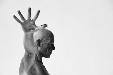 Man practicing perfect yoga photographed against a white background. 