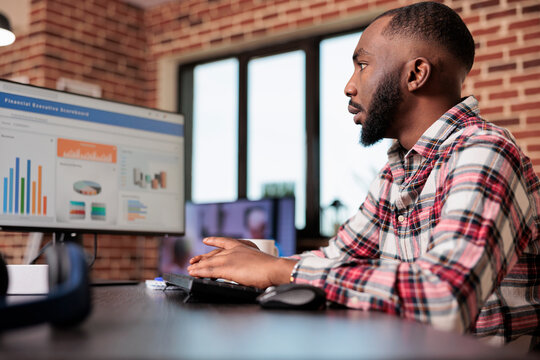 Business manager checking diagrams on computer, analyzing research data information on chars to create startup report and send email. Working remotely from home, doing freelance presentation.