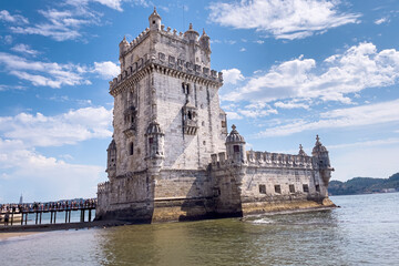 Obraz na płótnie Canvas Tourists walking nearby Belem tower in Lisbon