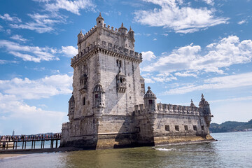 Obraz premium Tourists walking nearby Belem tower in Lisbon