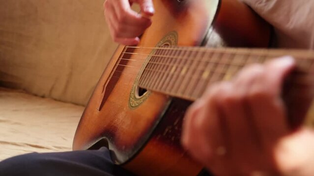 Woman hands playing classical acoustic guitar, closeup. Music concept. Girl learning to play song and writing music. Live music. Music festival. Instrument for hobby relax leisure education