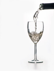 the process of pouring wine into a glass on a white background, a large space for text on the left