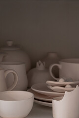 Fototapeta na wymiar Pottery made of clay. Handmade cups and mugs.