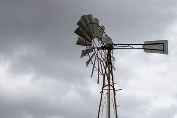 metal hydraulic weather vane in the artistic background composing natural landscape