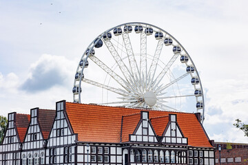 Fototapeta premium Beautiful architecture of the old city. Gdansk, Poland. European architecture. Ferris wheel.