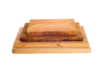 stack of wooden cutting boards of various sizes isolated on white background.