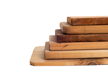 Set of brown, wooden, cutting boards of various sizes isolated on a white background.